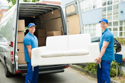 Packed moving boxes prepared for house removals in Lampton