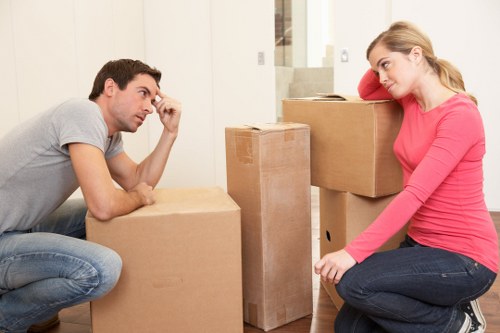 Removal team handling furniture during a Lampton house move